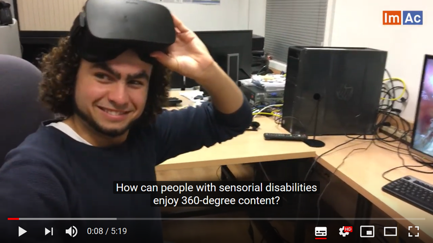 A clip from the YouTube video where a man is using the headset, smiling at the camera and the subtitles say 